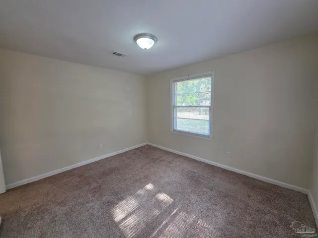 a bathroom with a toilet sink vanity and tub