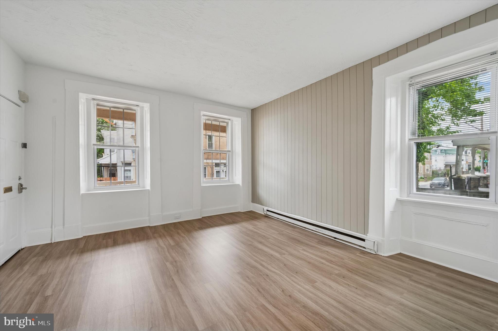 4381 Pechin Street Philadelphia, PA 19128 - Photo 11 of 46 a view of an empty room with wooden floor and a window