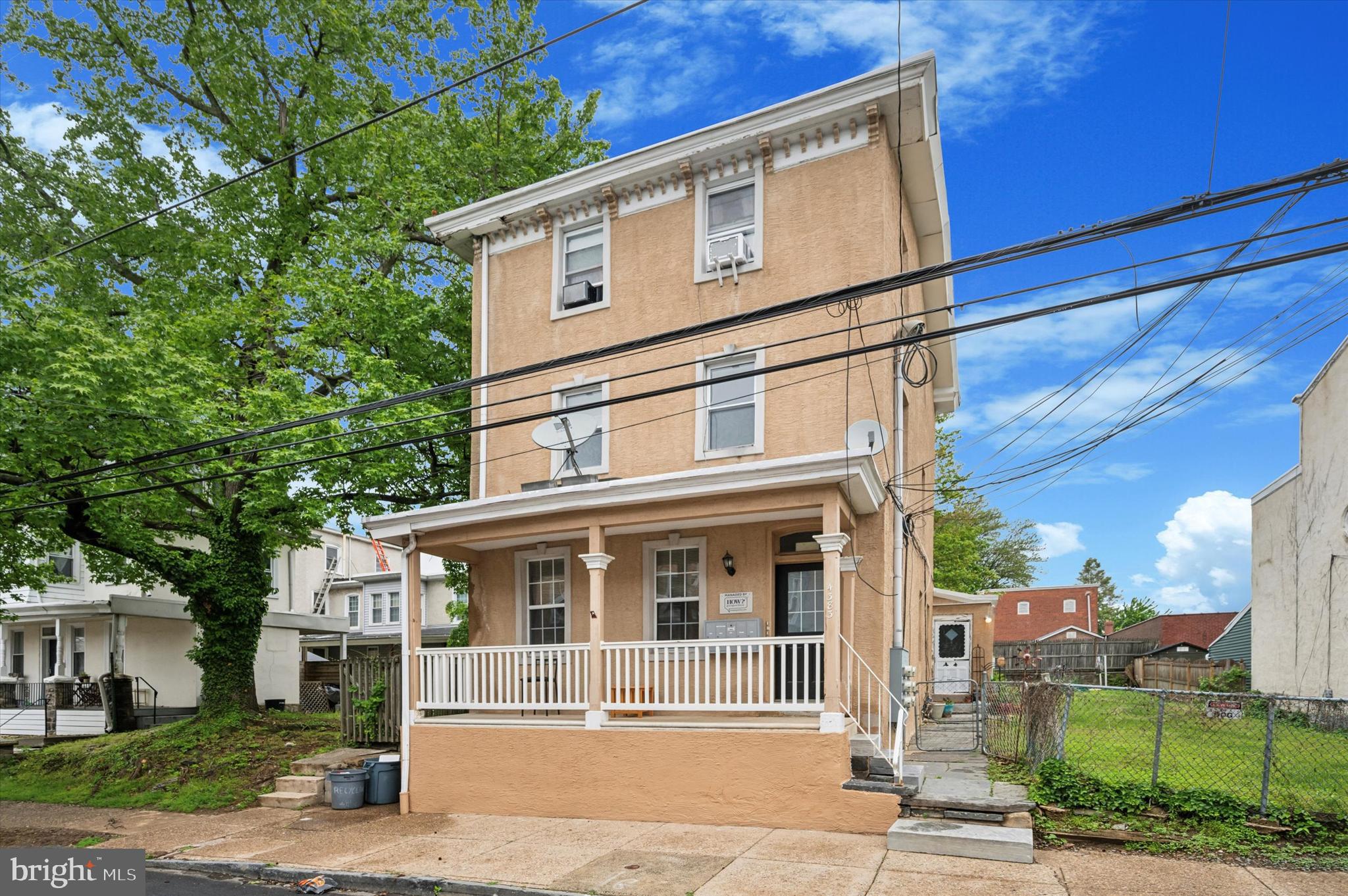 4381 Pechin Street Philadelphia, PA 19128 - Photo 2 of 46 a front view of a house with a garden and plants