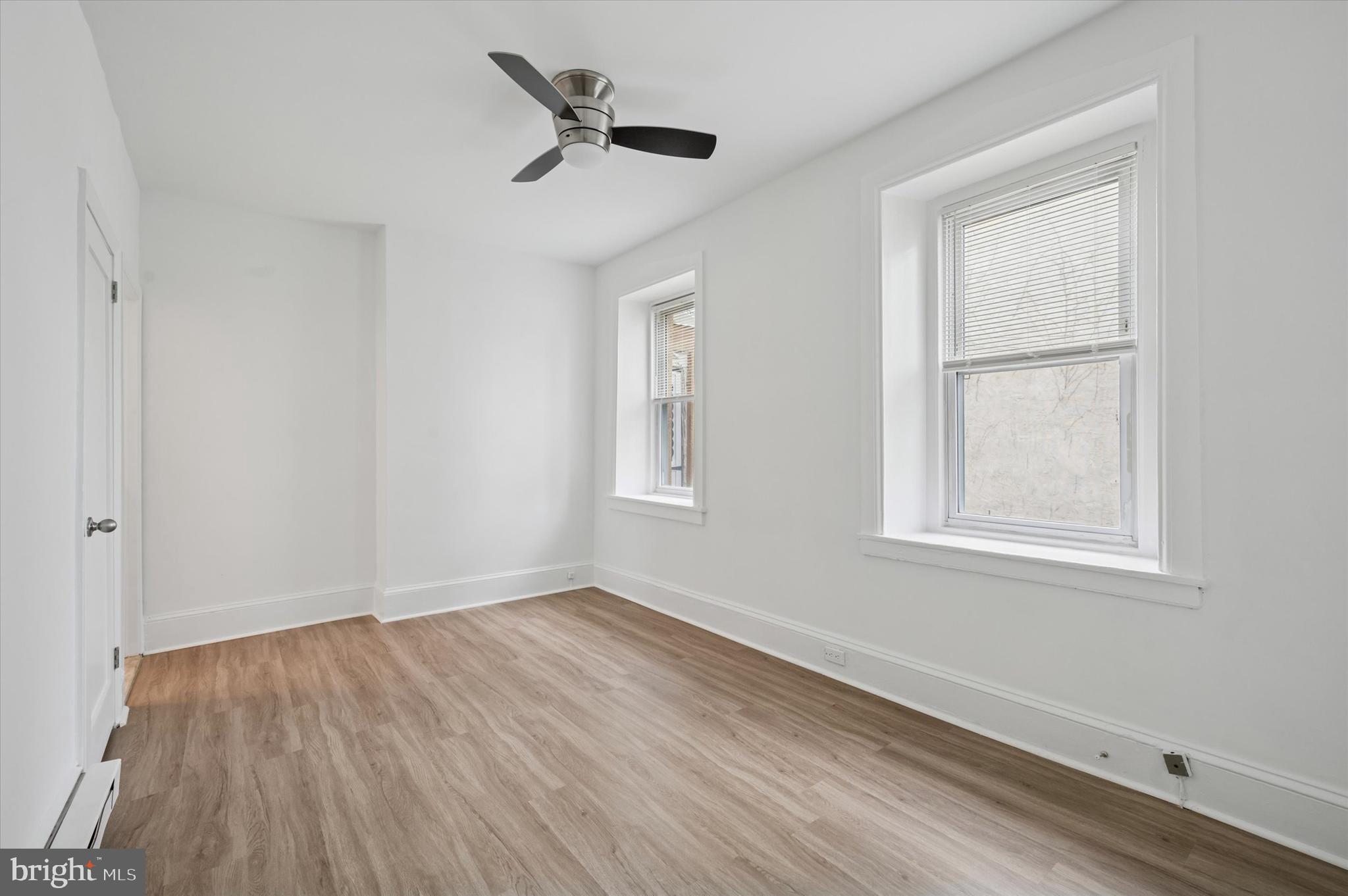 4381 Pechin Street Philadelphia, PA 19128 - Photo 23 of 46 a view of an empty room with wooden floor and a window