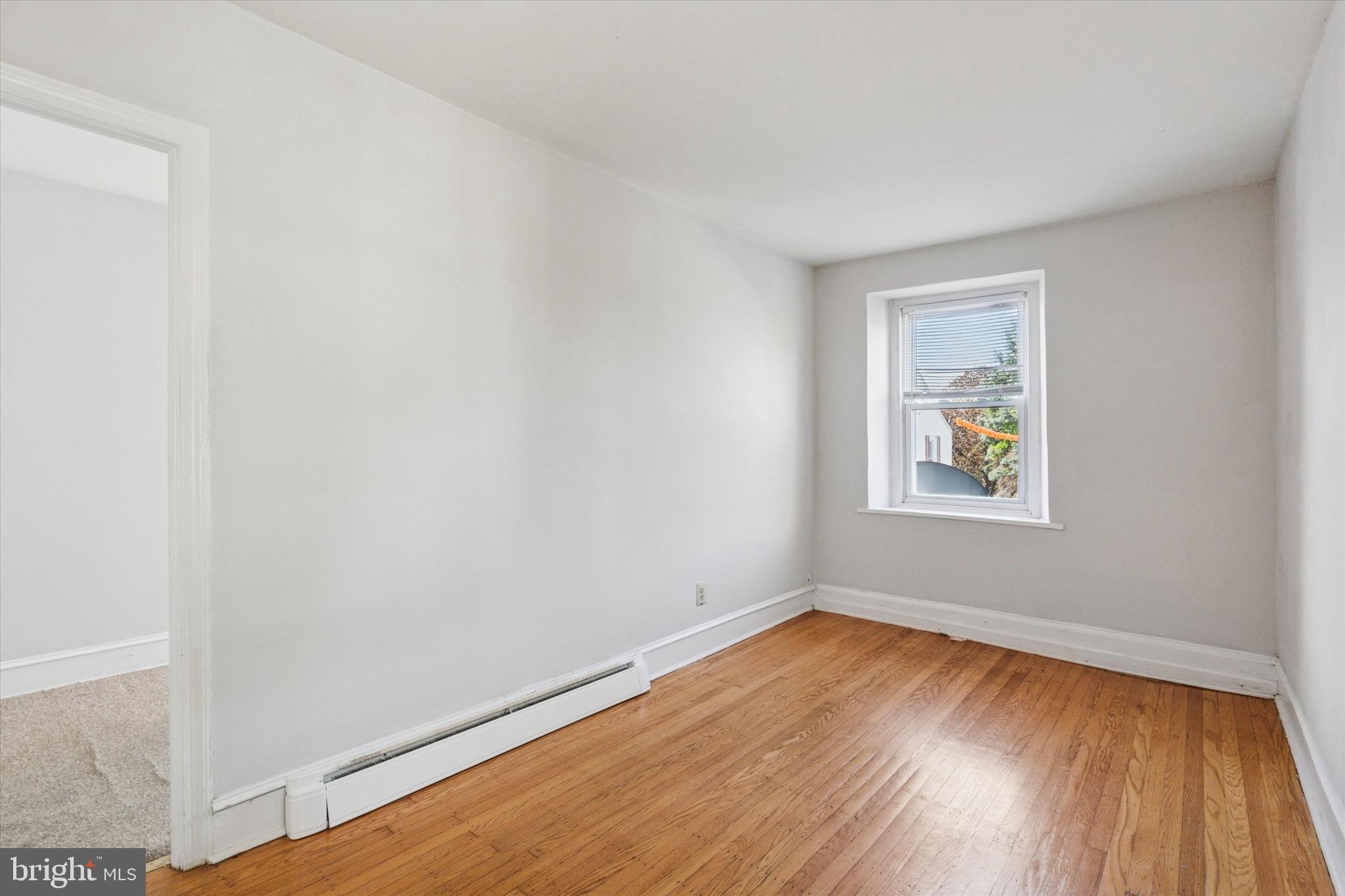 4381 Pechin Street Philadelphia, PA 19128 - Photo 26 of 46 wooden floor in an empty room with a window