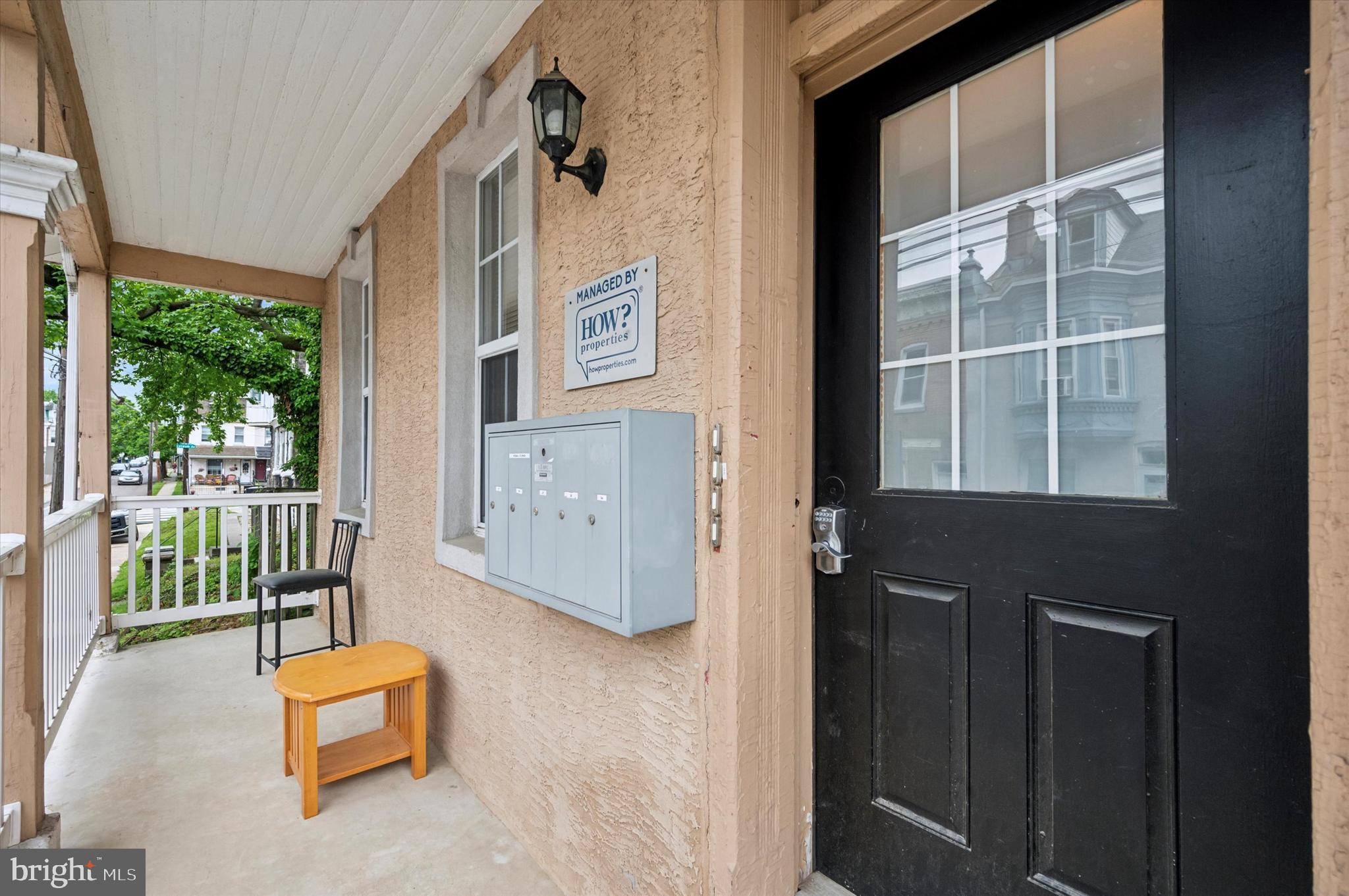 4381 Pechin Street Philadelphia, PA 19128 - Photo 3 of 46 a front door view of a house with a floor to ceiling window