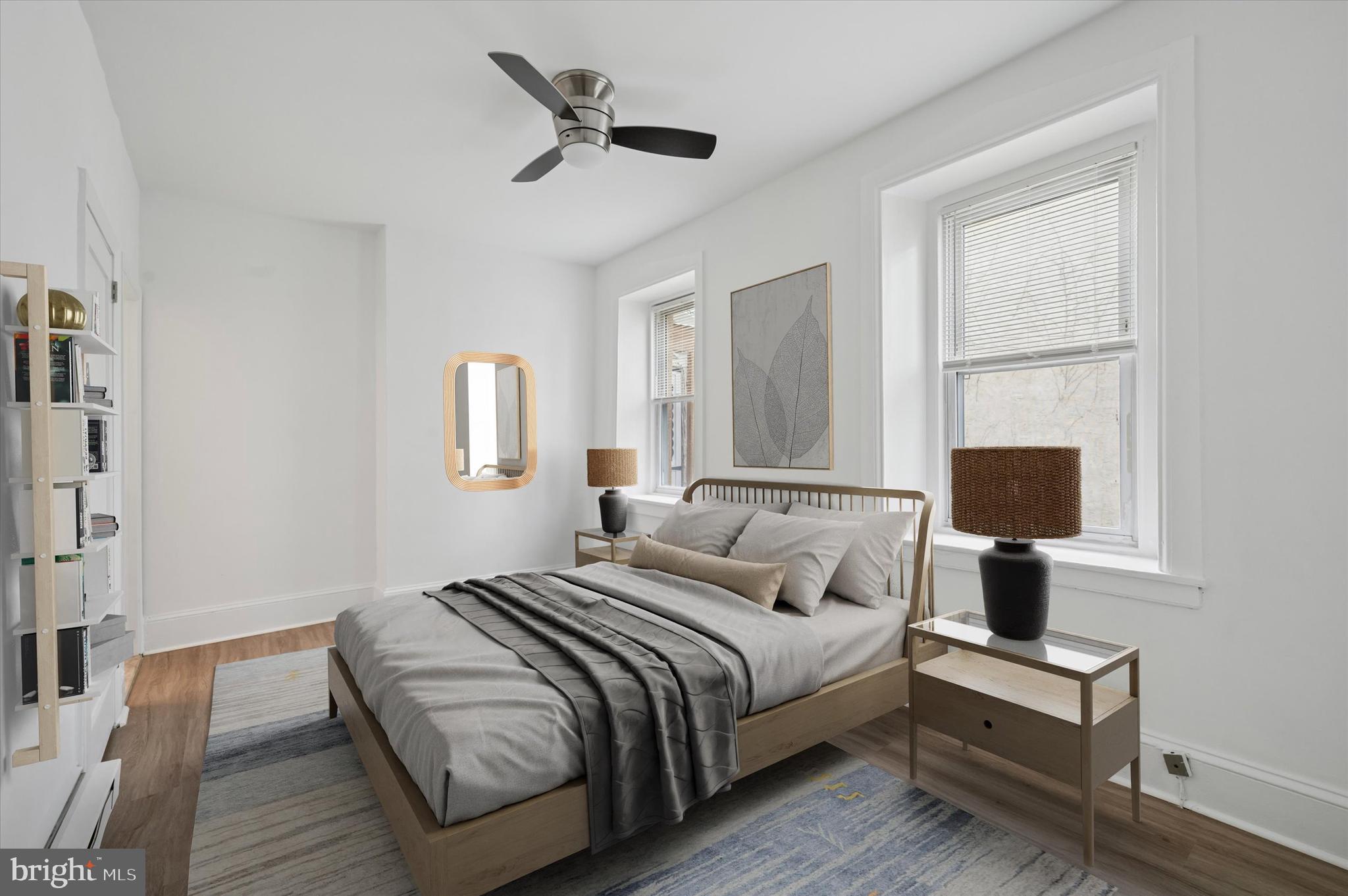 4381 Pechin Street Philadelphia, PA 19128 - Photo 31 of 46 a bedroom with a bed lamp on desk and a window