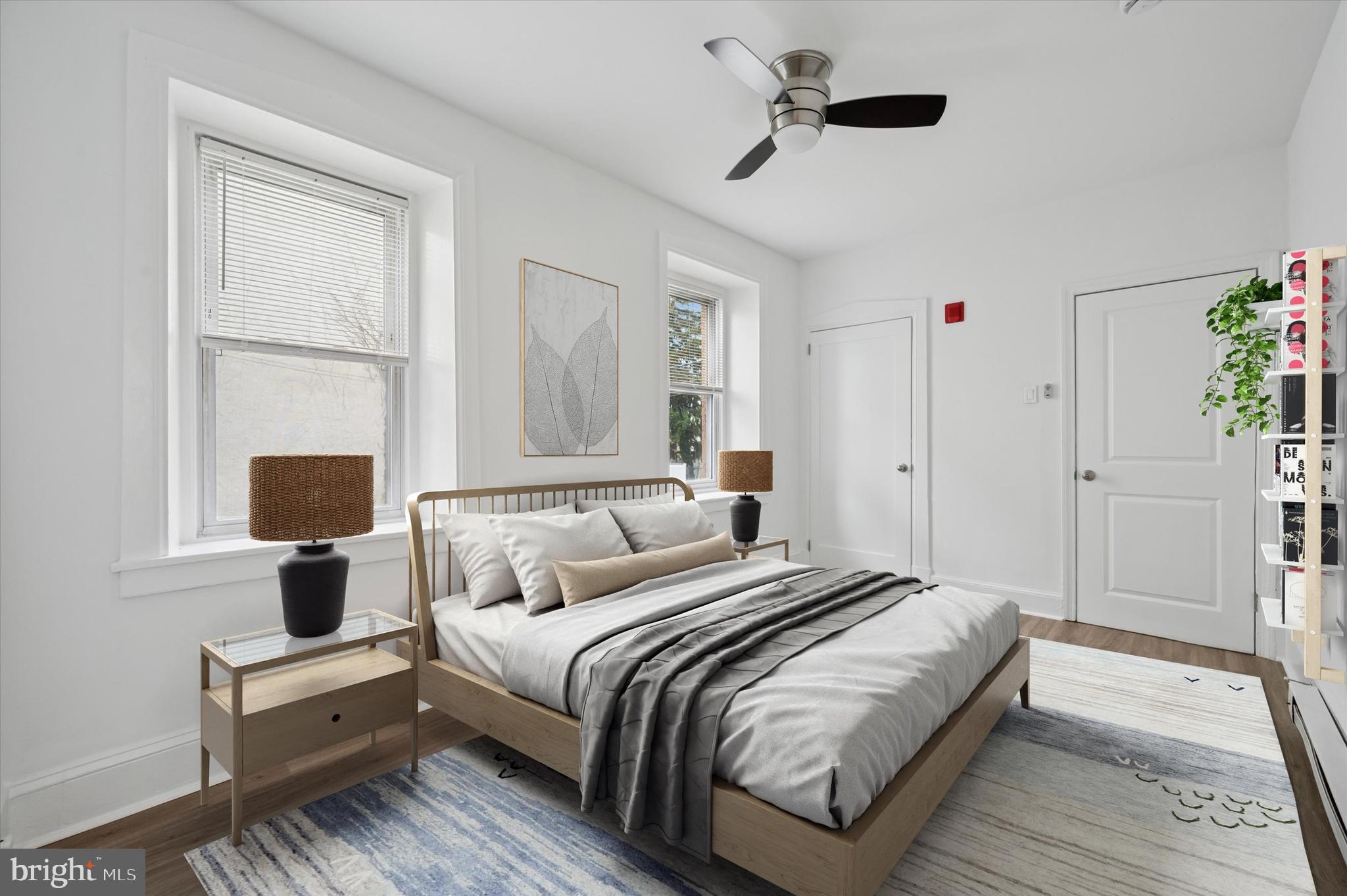 4381 Pechin Street Philadelphia, PA 19128 - Photo 33 of 46 a bedroom with a bed and wooden floor