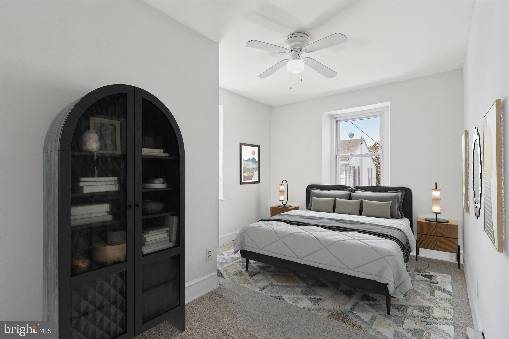 4381 Pechin Street Philadelphia, PA 19128 - Photo 34 of 46 a bedroom with a bed and a chandelier