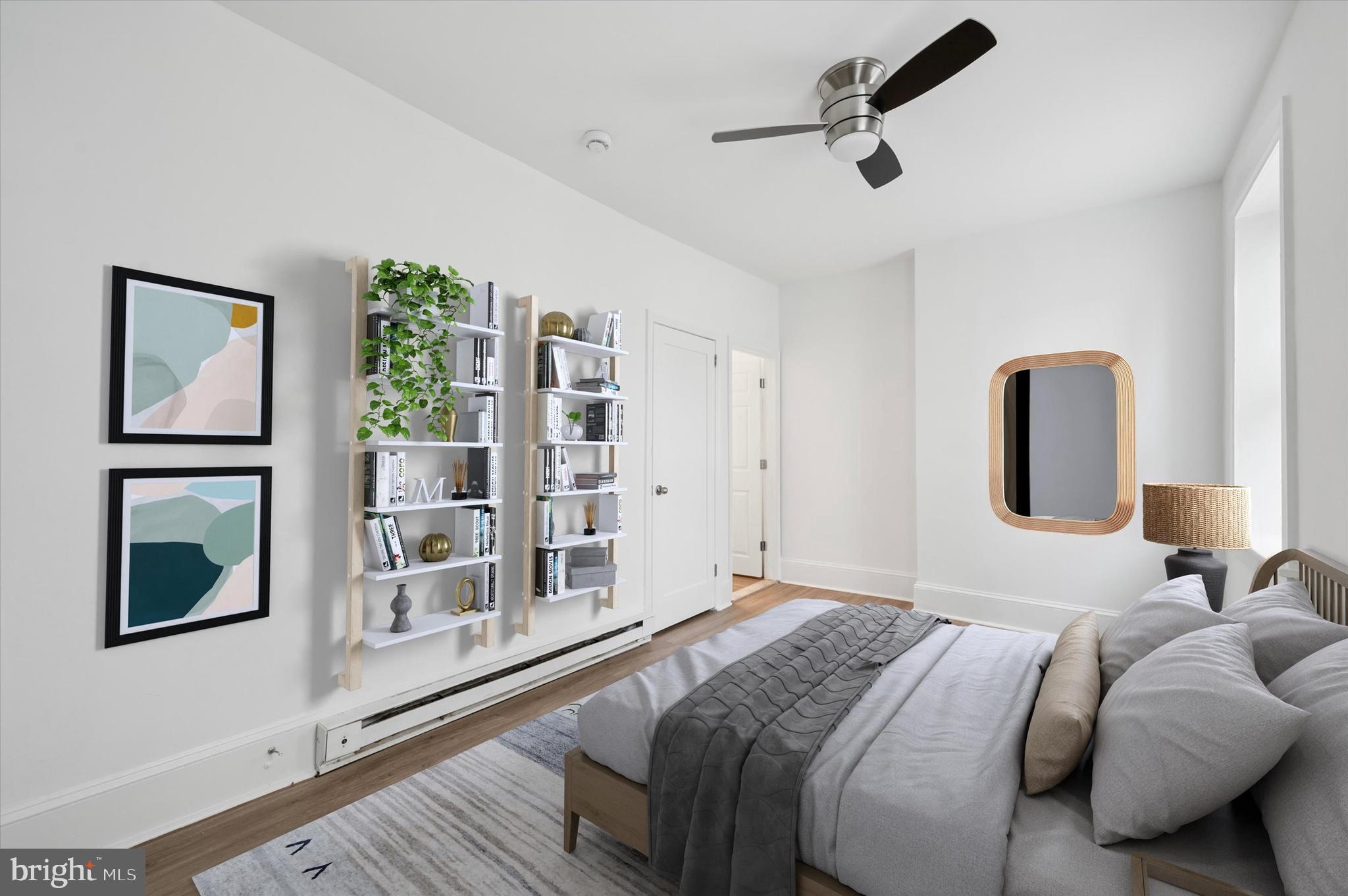 4381 Pechin Street Philadelphia, PA 19128 - Photo 35 of 46 a bedroom with a bed lamps and window