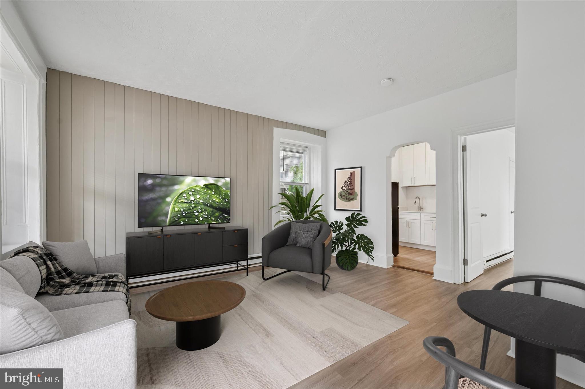 4381 Pechin Street Philadelphia, PA 19128 - Photo 37 of 46 a living room with furniture and a flat screen tv