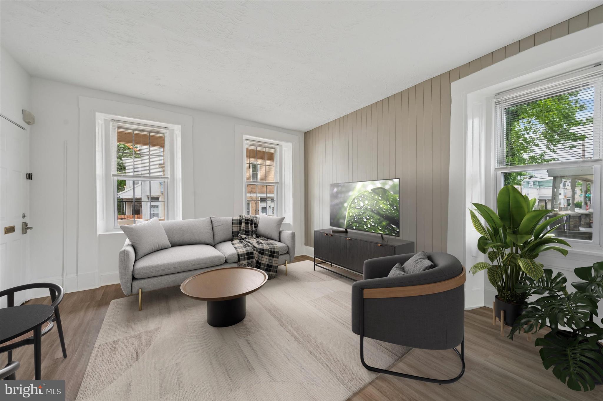 4381 Pechin Street Philadelphia, PA 19128 - Photo 39 of 46 a living room with furniture potted plant and a window