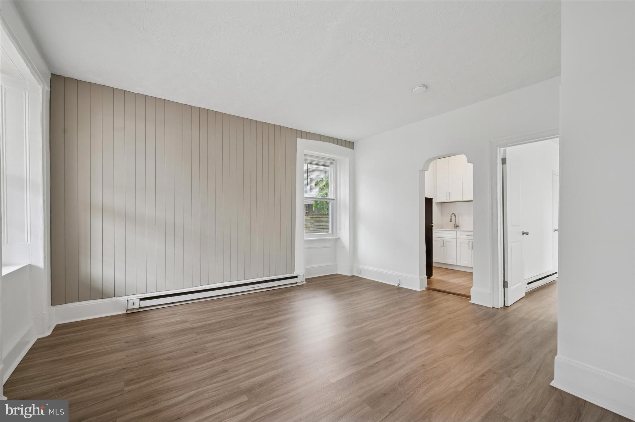 4381 Pechin Street Philadelphia, PA 19128 - Photo 7 of 46 an empty room with wooden floor & windows