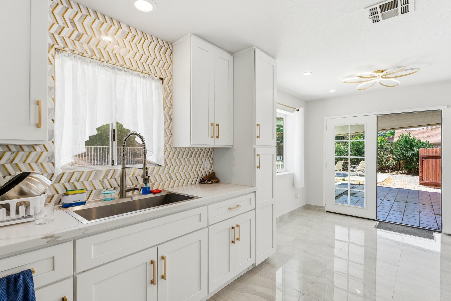 40961 Cecina Way Bermuda Dunes, CA 92203 - Photo 23 of 27 a kitchen with counter top space and windows