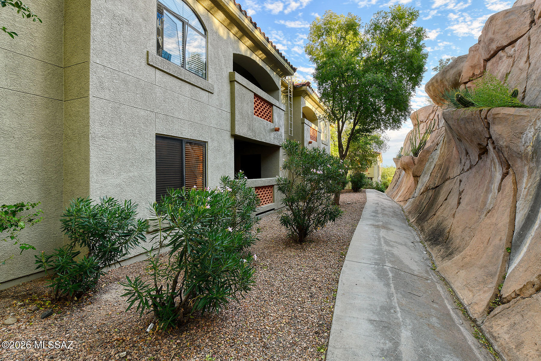 5751 North Kolb Road, Unit 20104 Tucson, AZ 85750 - Photo 3 of 28 Dramatic Rock Wall