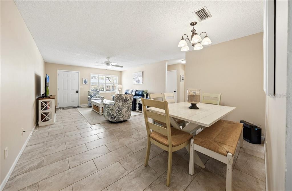 8877 Southwest 96th Street, Unit B Ocala, FL 34481 - Photo 11 of 48 a view of a dining room with furniture