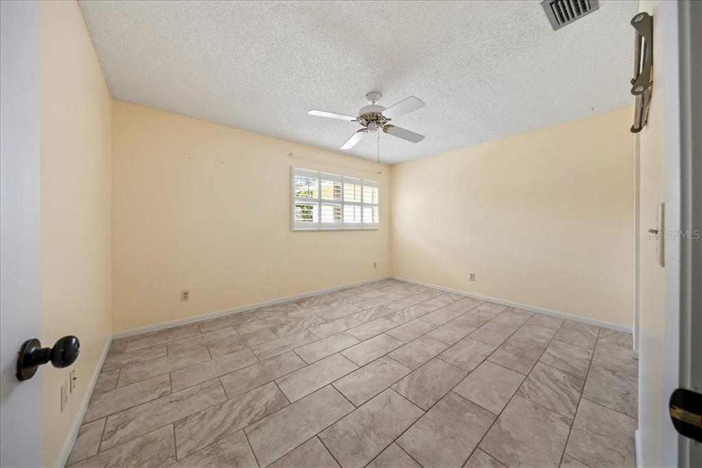 8877 Southwest 96th Street, Unit B Ocala, FL 34481 - Photo 20 of 48 a view of an empty room with a window