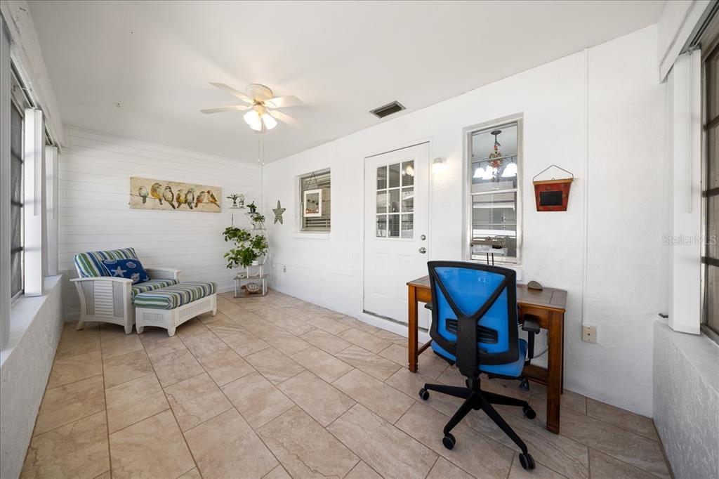 8877 Southwest 96th Street, Unit B Ocala, FL 34481 - Photo 24 of 48 a living room with furniture and a dining table with wooden floor