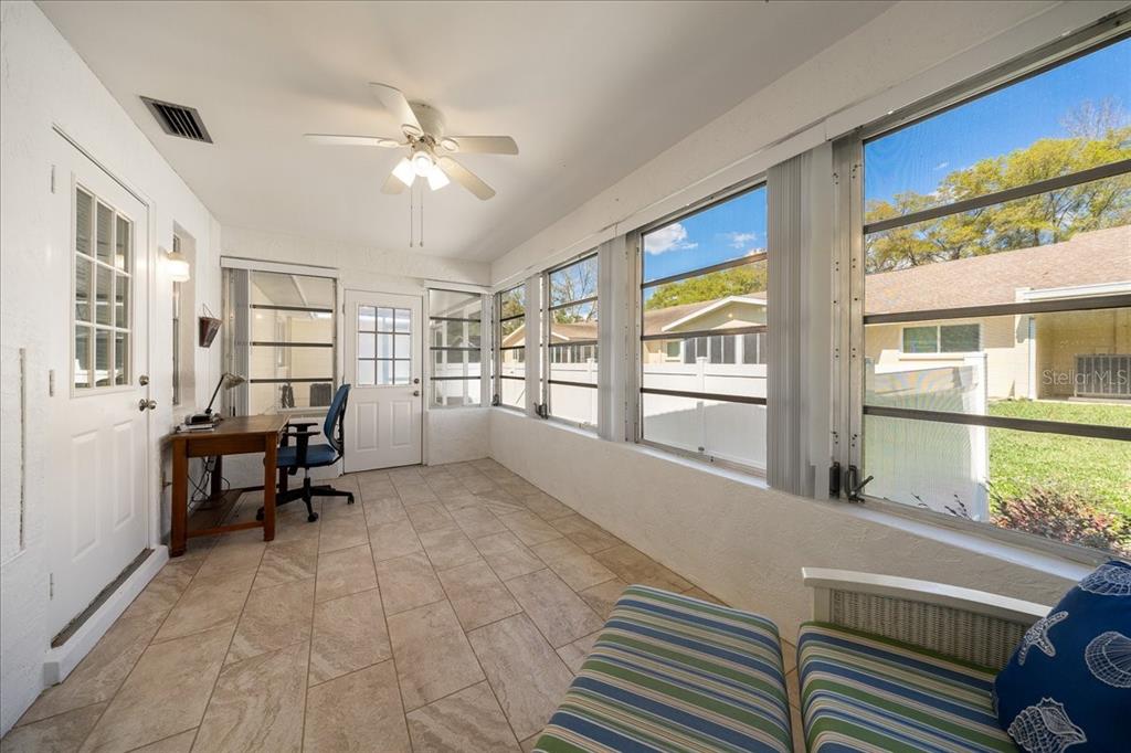8877 Southwest 96th Street, Unit B Ocala, FL 34481 - Photo 25 of 48 a living room with furniture and a large window