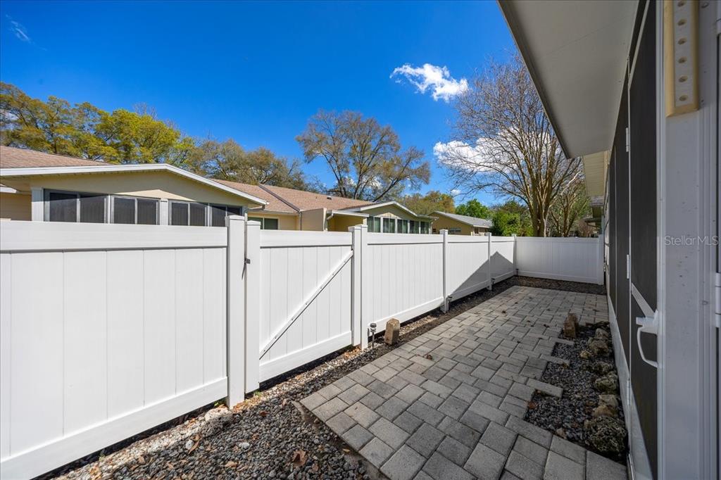 8877 Southwest 96th Street, Unit B Ocala, FL 34481 - Photo 28 of 48 a view of a house with a yard