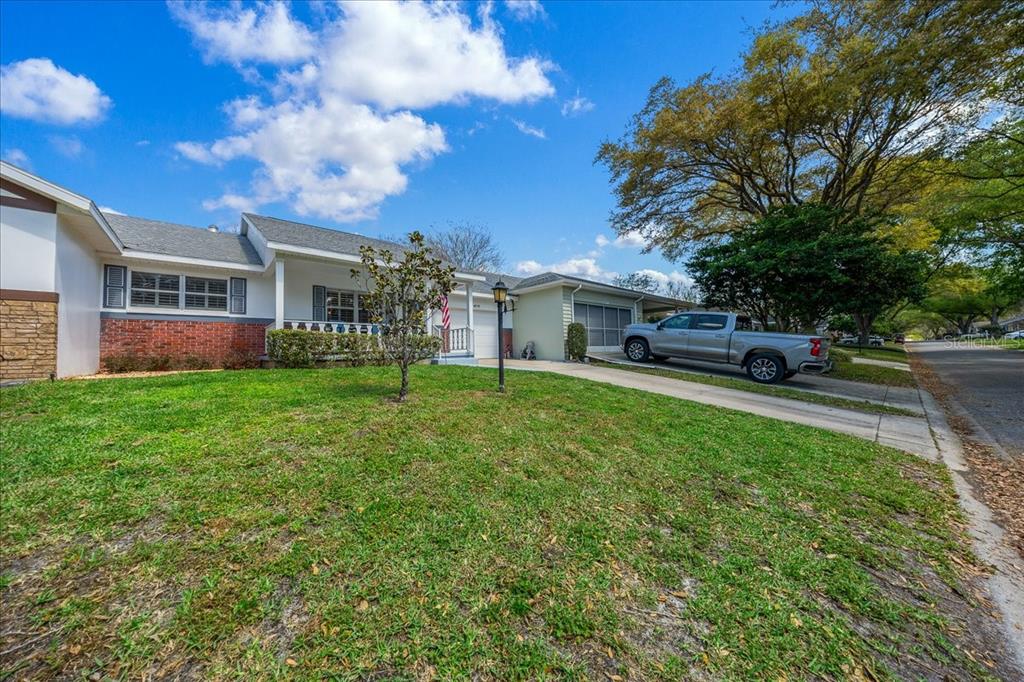 8877 Southwest 96th Street, Unit B Ocala, FL 34481 - Photo 3 of 48 a view of a house with a back yard