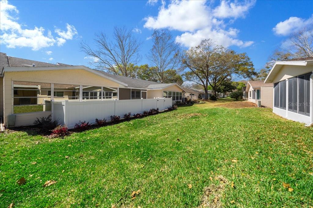 8877 Southwest 96th Street, Unit B Ocala, FL 34481 - Photo 31 of 48 a view of house with yard and entertaining space