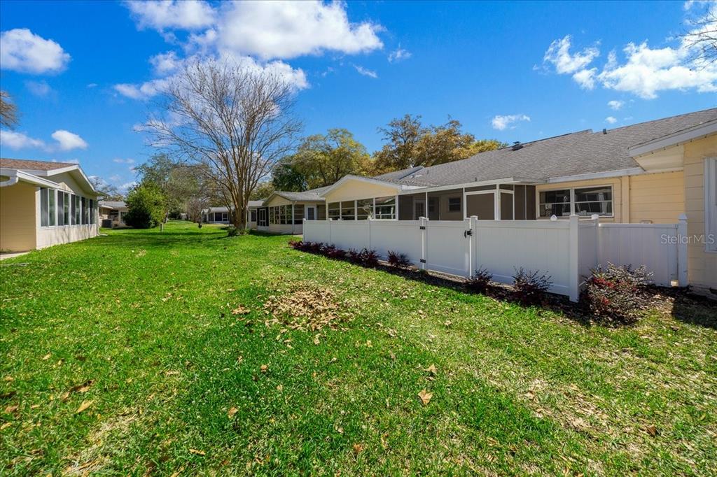 8877 Southwest 96th Street, Unit B Ocala, FL 34481 - Photo 32 of 48 a view of house with yard and green space