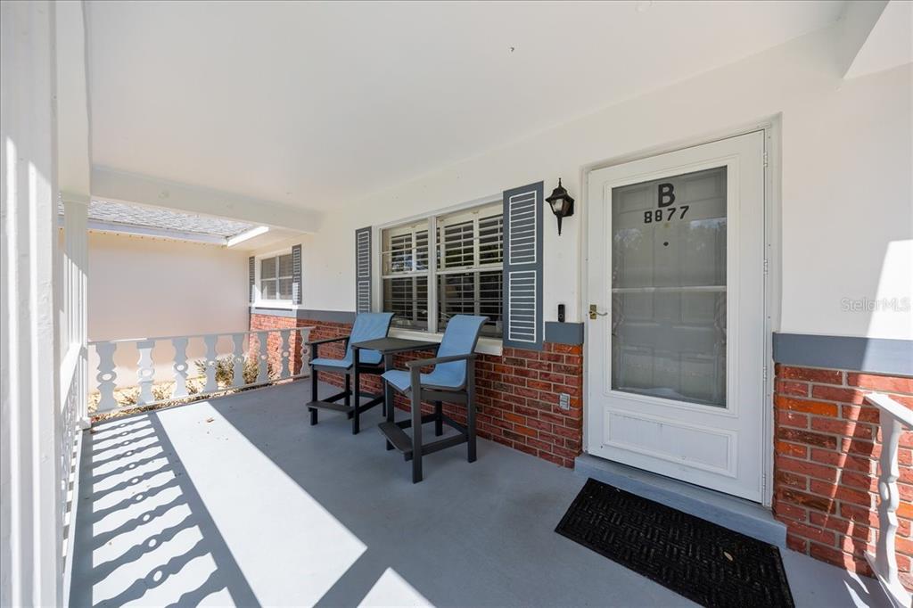 8877 Southwest 96th Street, Unit B Ocala, FL 34481 - Photo 5 of 48 a living room with furniture and a gate