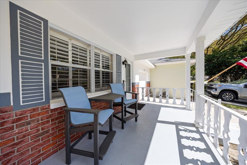 8877 Southwest 96th Street, Unit B Ocala, FL 34481 - Photo 6 of 48 a view of a dining room with furniture and wooden floor