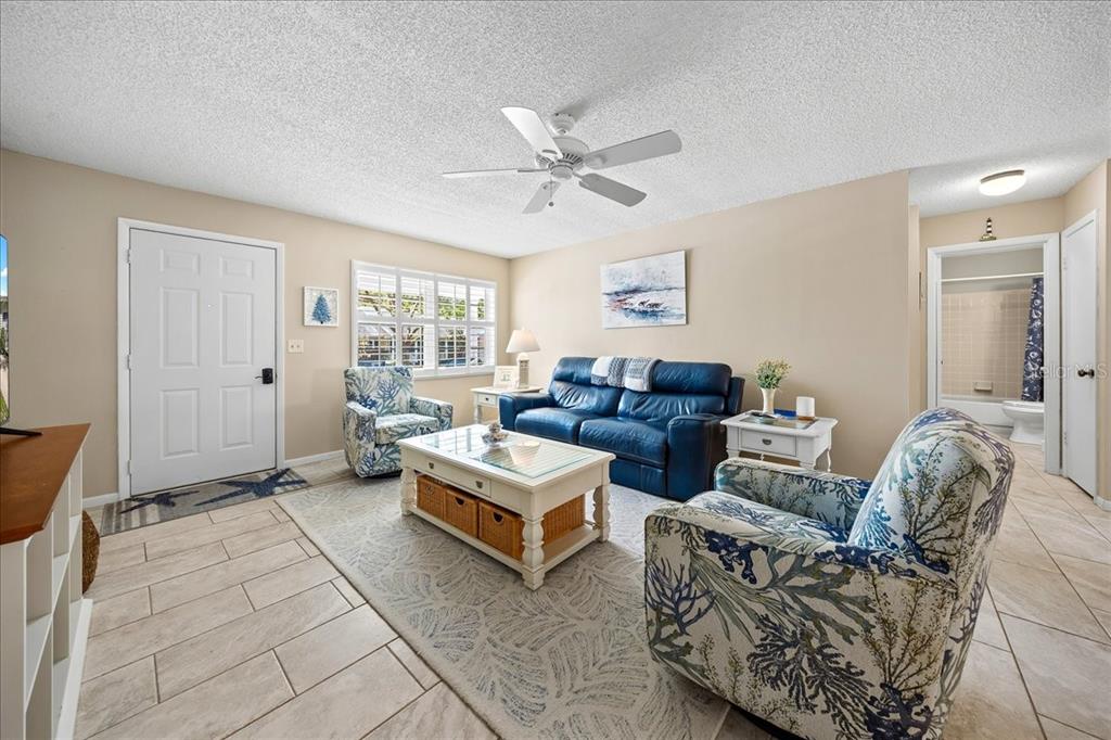 8877 Southwest 96th Street, Unit B Ocala, FL 34481 - Photo 8 of 48 a living room with furniture and a window