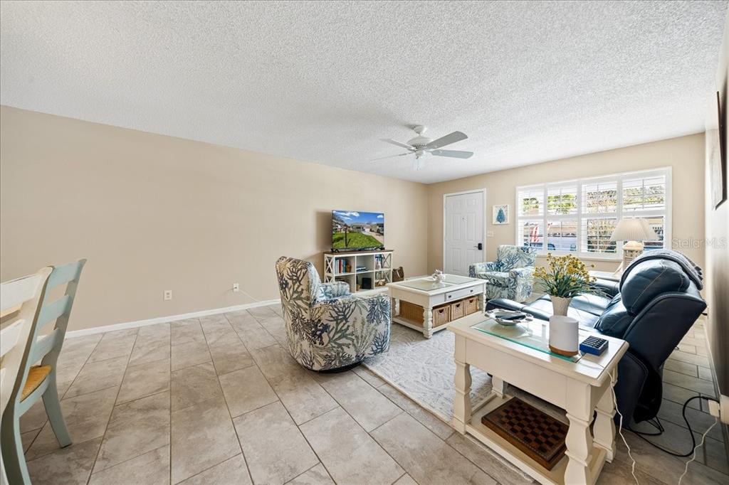 8877 Southwest 96th Street, Unit B Ocala, FL 34481 - Photo 9 of 48 a living room with furniture and a window