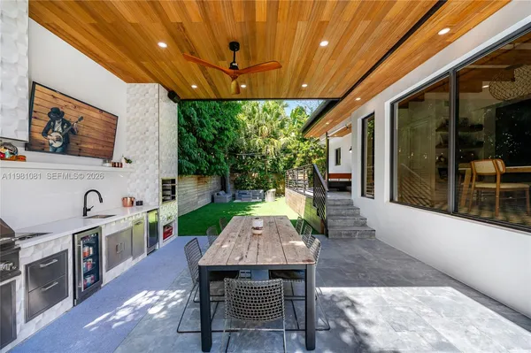 a dining room with furniture a garden and chandelier