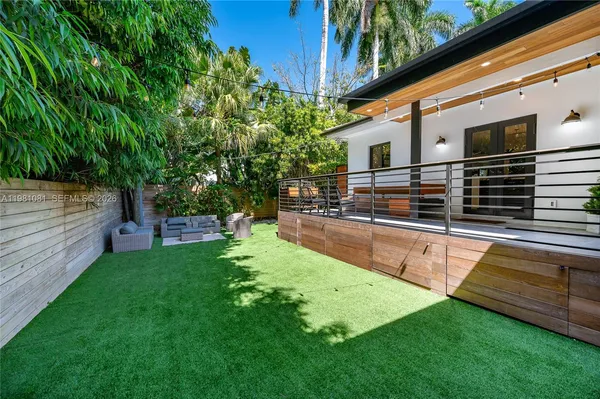 a view of backyard with swimming pool