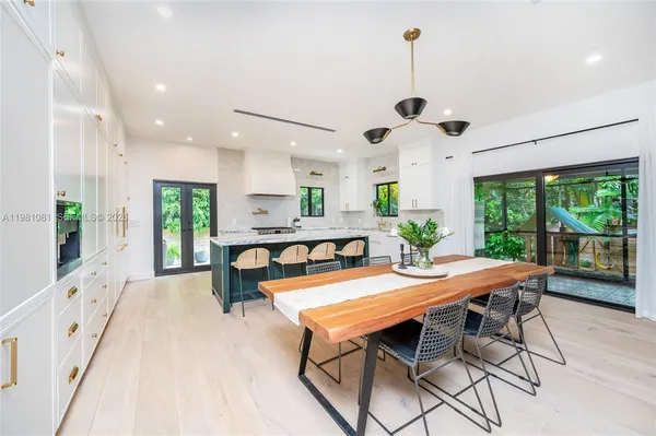 a kitchen with stainless steel appliances granite countertop counter space and windows