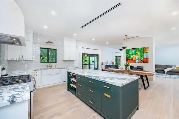 a outdoor space with furniture a flat screen tv and a entrance