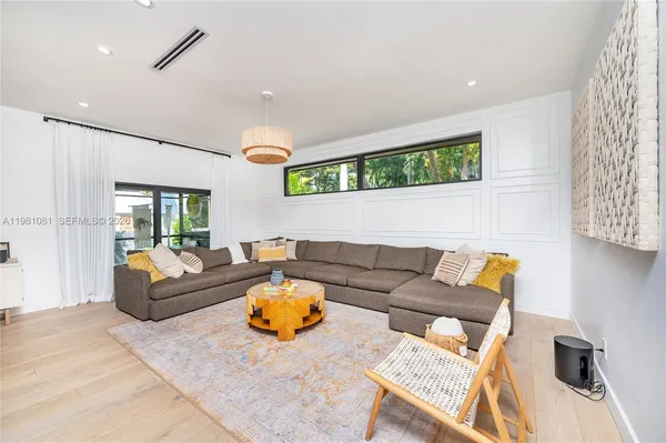 a living room with furniture and a window
