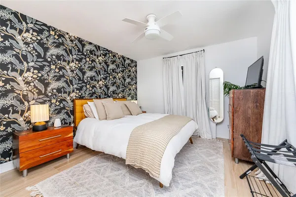 a bathroom with a shower sink and mirror