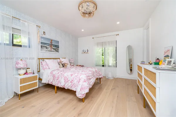 a bathroom with a sink toilet and a mirror