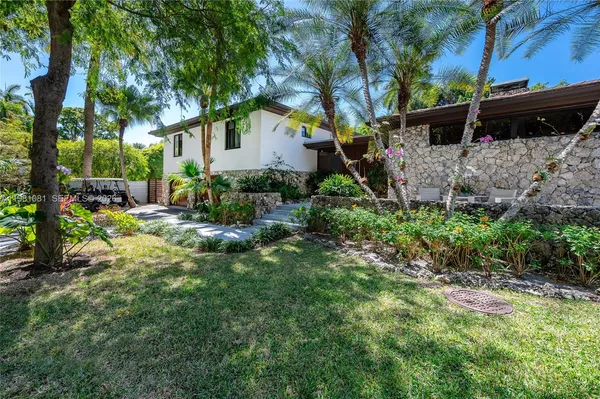 a backyard of a house with lots of green space