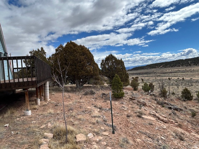 45720 Airport Road Fruitland, UT 84027 - Photo 18 of 22 View of yard featuring a wooden deck and a view of rural / pastoral area