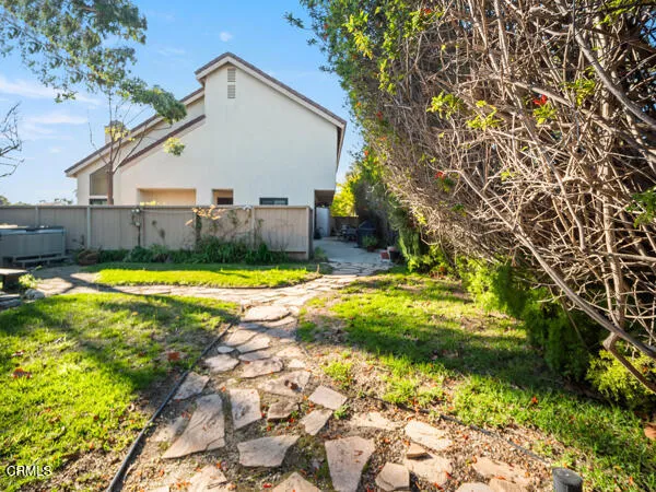 a view of a backyard with swimming pool