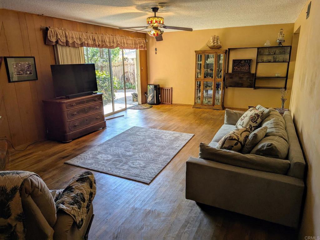10309 Challenge Boulevard La Mesa, CA 91941 - Photo 15 of 51 a living room with furniture and a flat screen tv