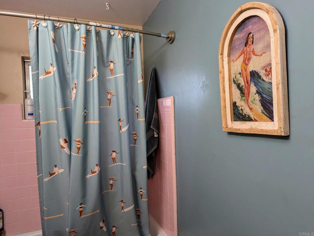 10309 Challenge Boulevard La Mesa, CA 91941 - Photo 21 of 51 a bathroom with a granite countertop shower and a sink