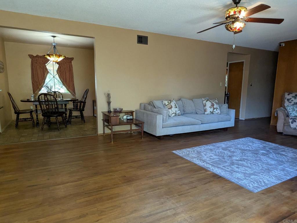 10309 Challenge Boulevard La Mesa, CA 91941 - Photo 4 of 51 a living room with furniture and a chandelier