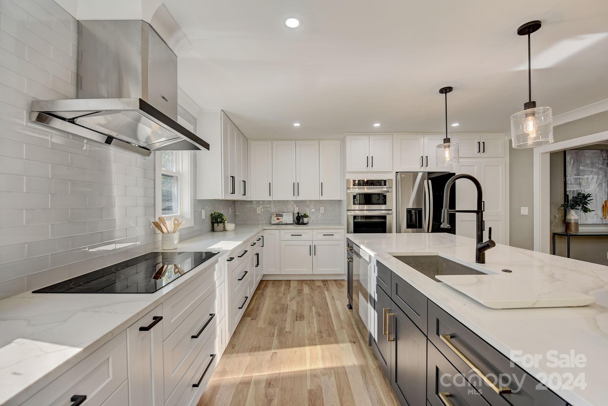 201 Potter Road Monroe, NC 28110 - Photo 13 of 44 a large kitchen with granite countertop lots of counter space sink and appliances