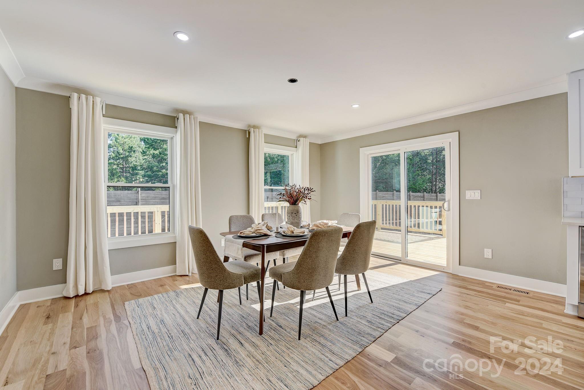 201 Potter Road Monroe, NC 28110 - Photo 16 of 44 a view of a dining room with furniture window and wooden floor