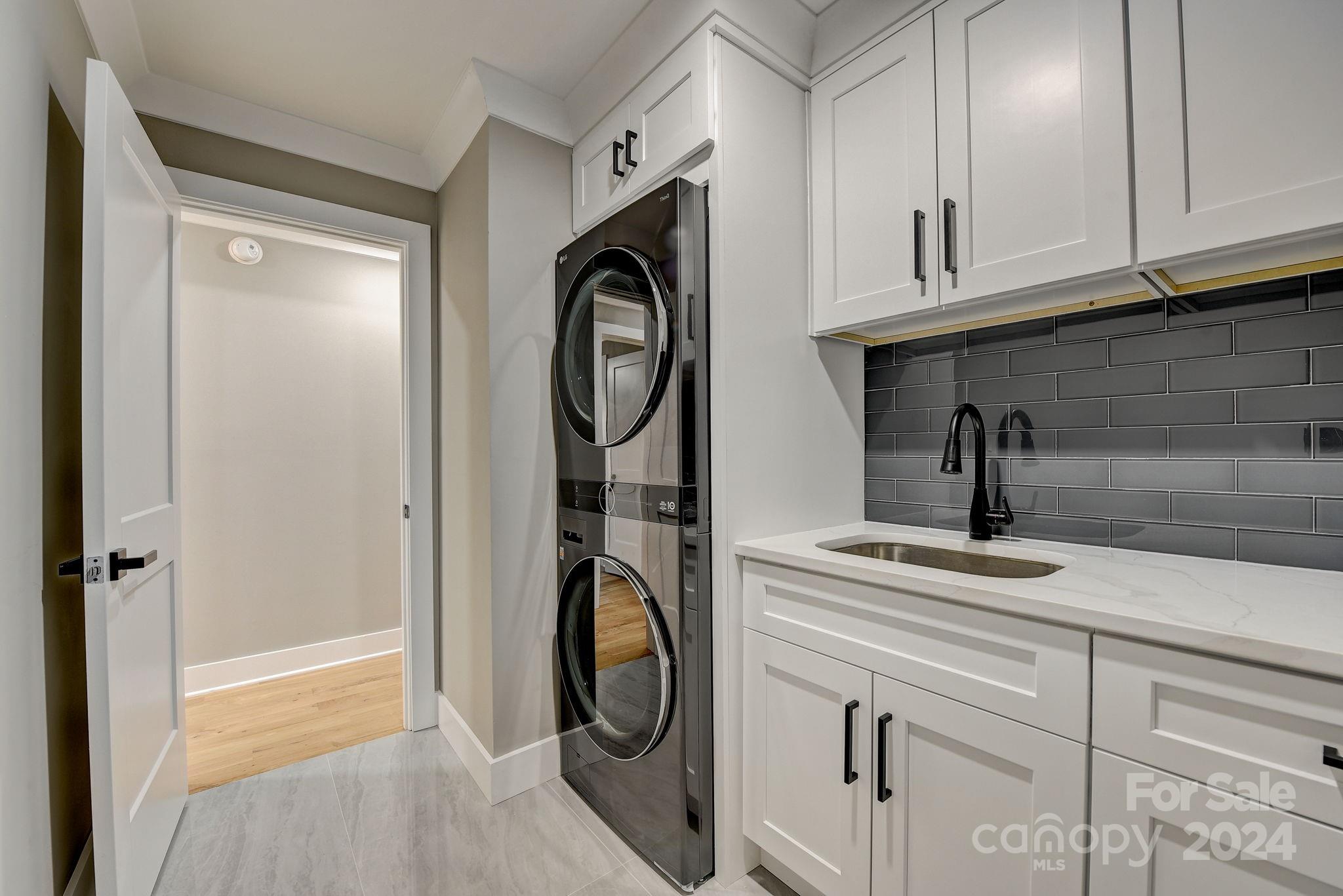 201 Potter Road Monroe, NC 28110 - Photo 17 of 44 a utility room with cabinets
