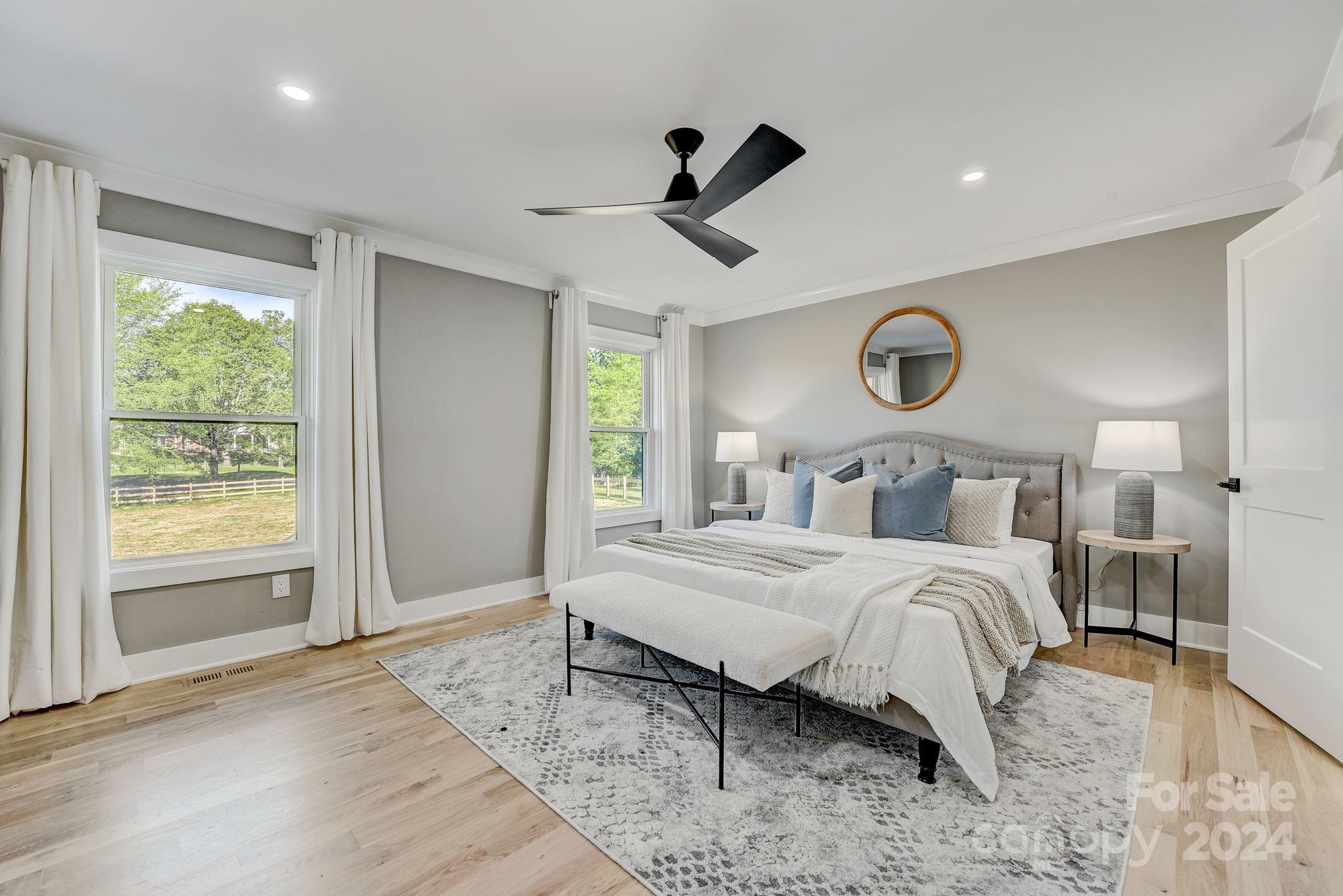 201 Potter Road Monroe, NC 28110 - Photo 19 of 44 a bedroom with a bed and a large window