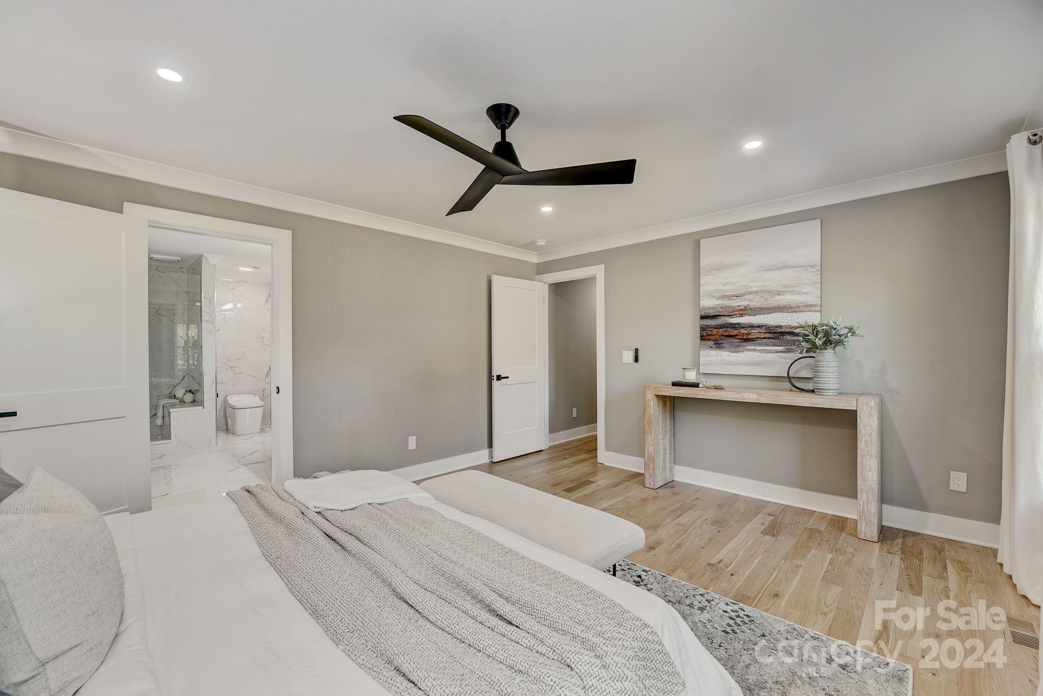 201 Potter Road Monroe, NC 28110 - Photo 21 of 44 a bedroom with a bed and a ceiling fan