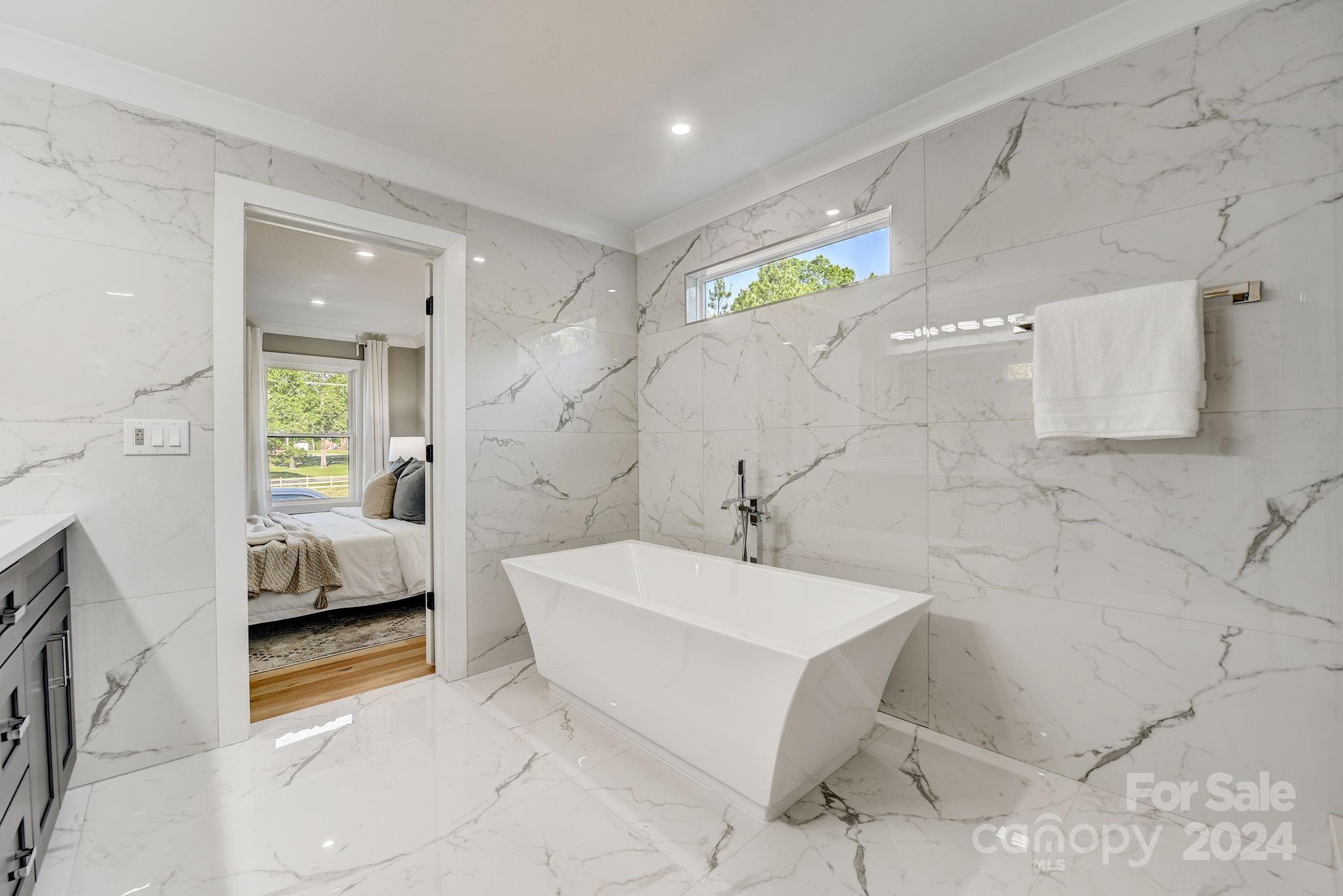 201 Potter Road Monroe, NC 28110 - Photo 22 of 44 a spacious bathroom with a bathtub and a shower