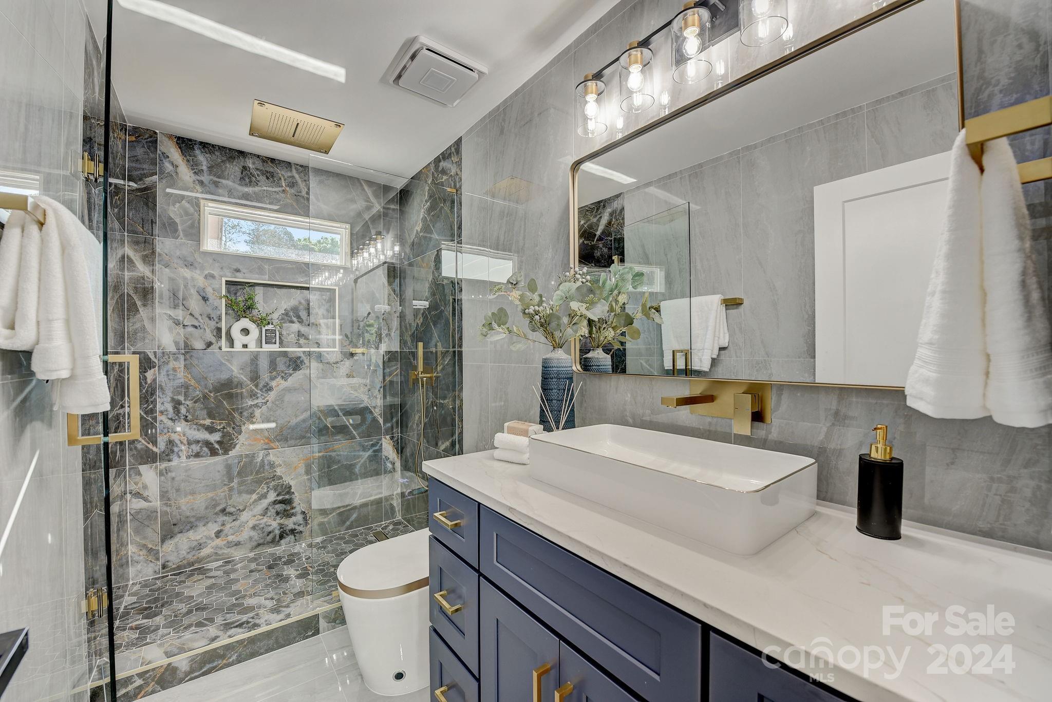 201 Potter Road Monroe, NC 28110 - Photo 30 of 44 a bathroom with a sink a toilet and shower