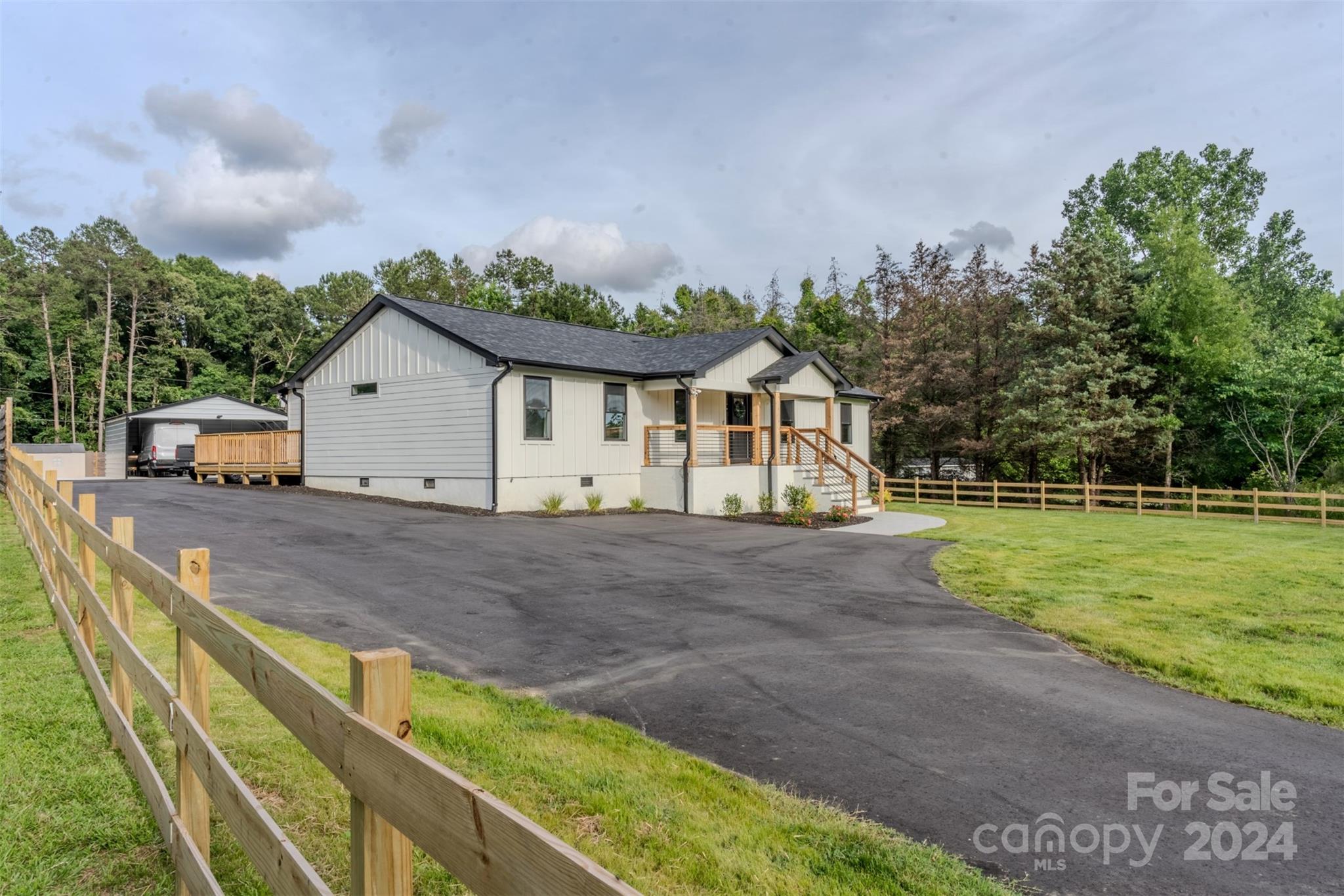 201 Potter Road Monroe, NC 28110 - Photo 3 of 44 a view of house with backyard and garden