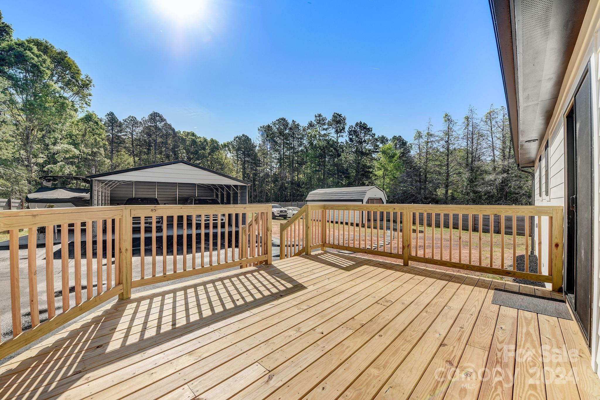 201 Potter Road Monroe, NC 28110 - Photo 34 of 44 a view of balcony with wooden floor and fence