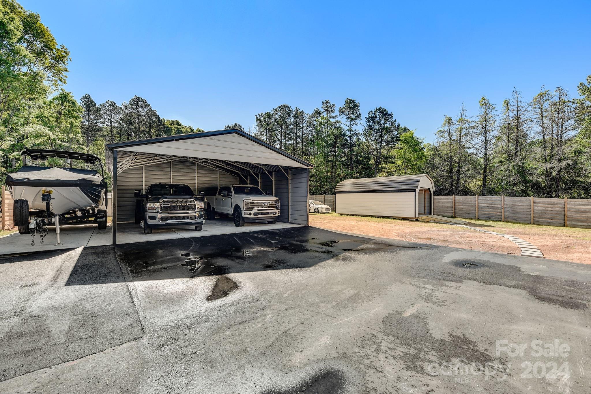 201 Potter Road Monroe, NC 28110 - Photo 35 of 44 a front view of a house with a yard and a garage